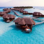 brown wooden cottage on blue body of water during daytime